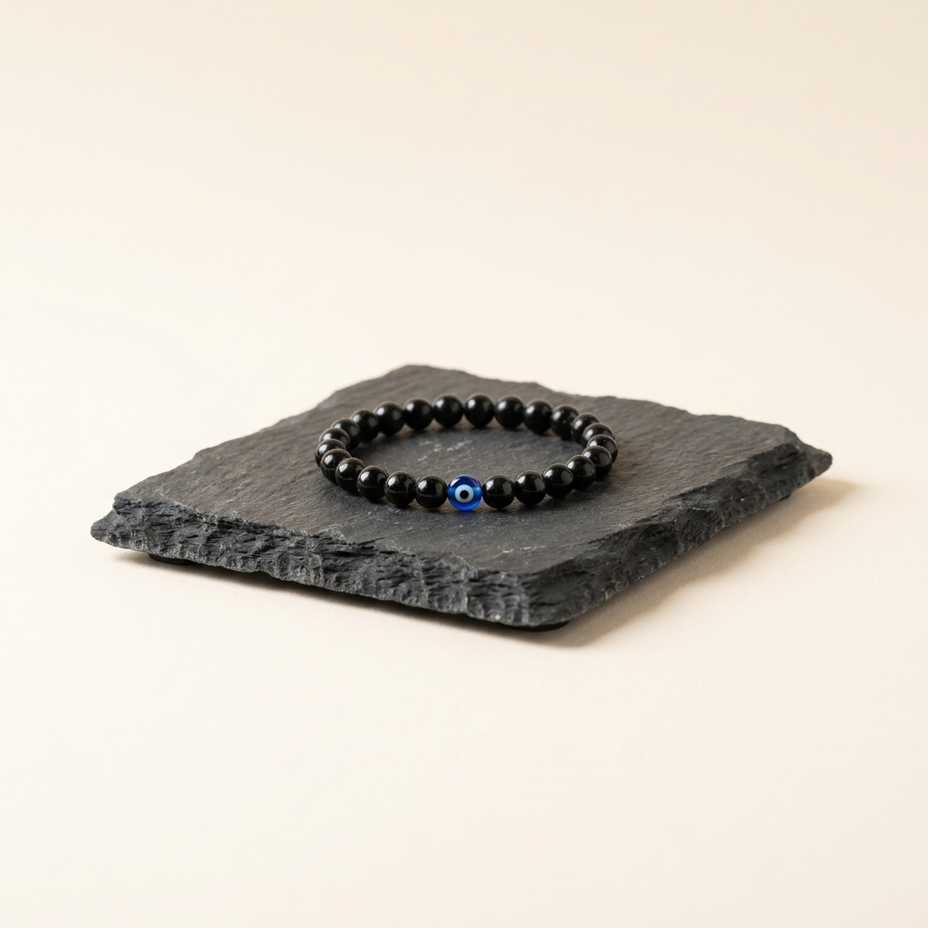 Protection & Negativity — black tourmaline bracelet with evil eye bead