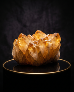 Golden Citrine Cluster glowing on dark background, wealth crystal – Horocosmo