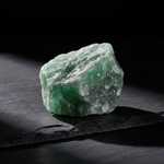 Green Aventurine glowing on dark slate, Stone of Opportunity – Horocosmo