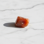 Natural Carnelian crystal on white marble – Horocosmo