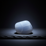 Natural Blue Chalcedony stone with soft blue glow on dark background – Horocosmo