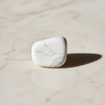 Natural white Howlite stone with grey veins on marble – Horocosmo
