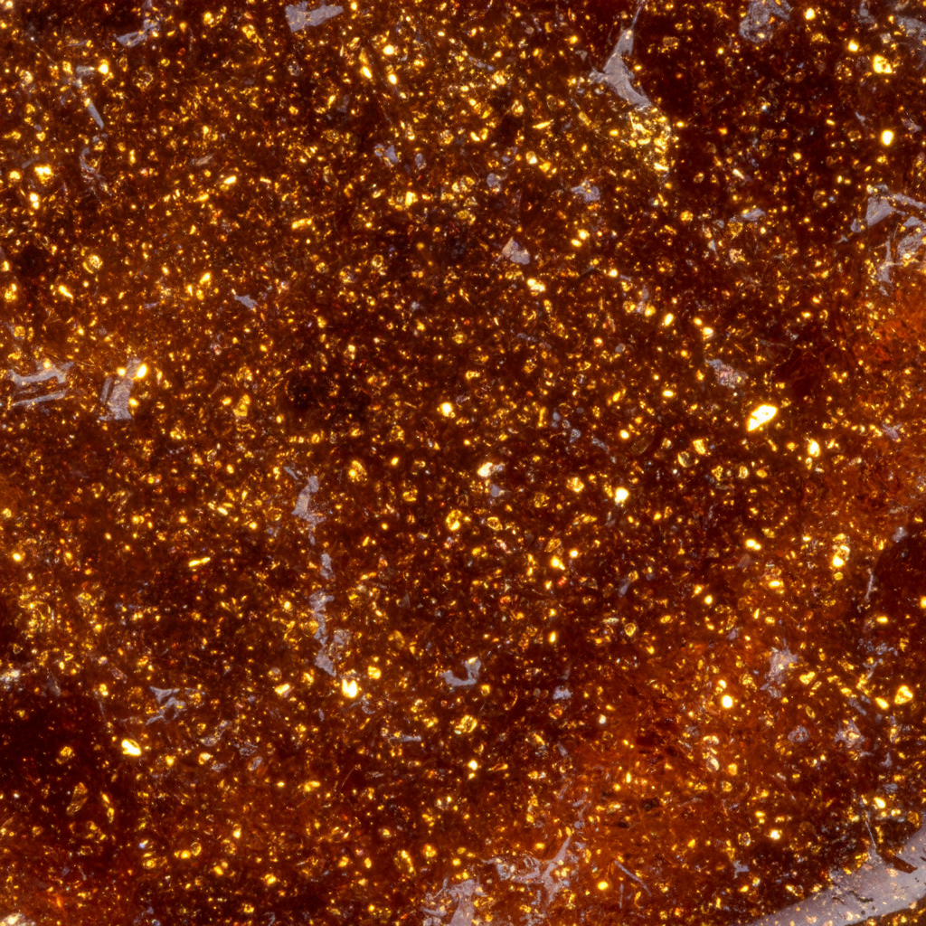 Macro of Goldstone showing dense copper sparkle in glass – Horocosmo