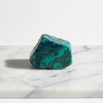 Natural Chrysocolla vivid blue-green stone on white marble – Horocosmo