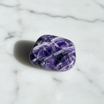 Natural Charoite swirling violet stone on white marble – Horocosmo