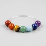 Seven-stone chakra crystal bracelet – representative image; natural stones vary slightly in shade